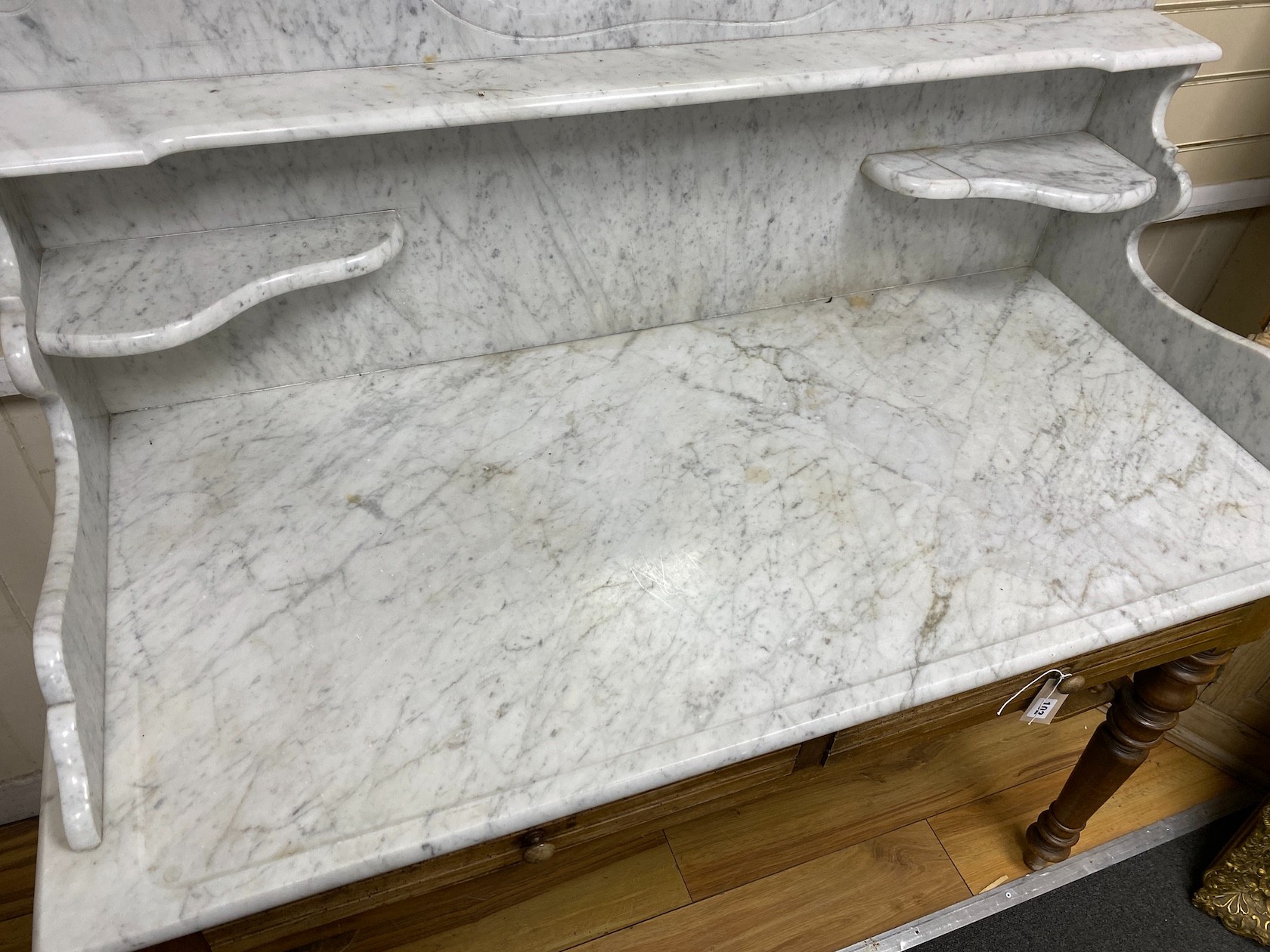 A 19th century French mahogany marble top washstand with high mirrored back, width 130cm, depth 60cm, height 204cm